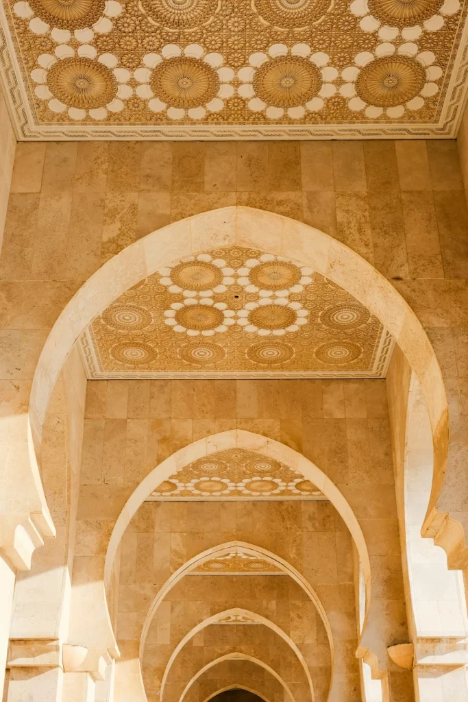An arched passageway with a richly decorated ceiling
