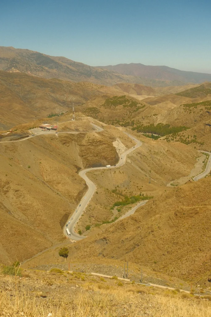A winding road through dry mountain scenery