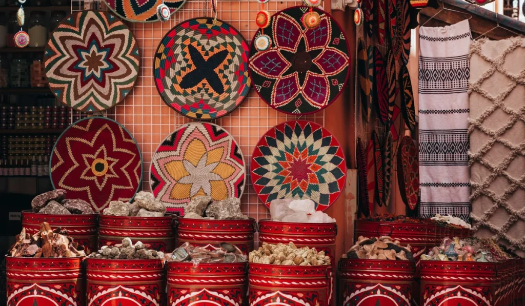 Colourful spices and crafts displayed at a Moroccan market stall